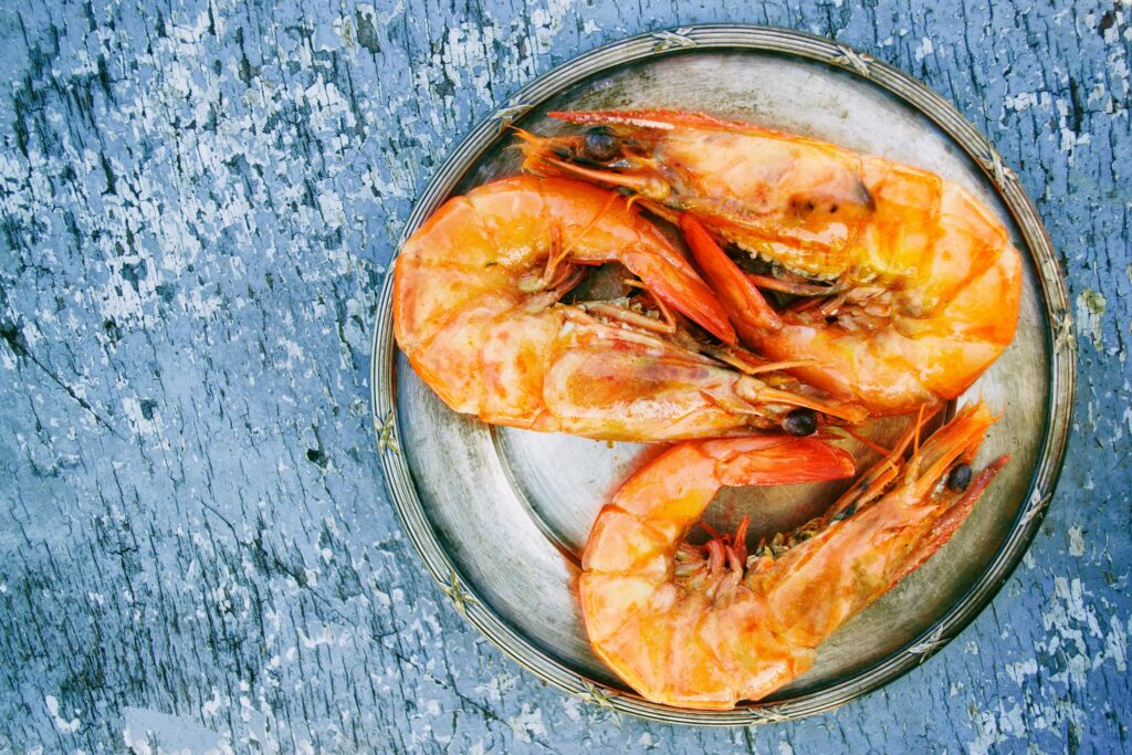 pexels photo 725992 725992 Top view of cooked shrimps on a metal plate on rustic surface. Perfect for seafood lovers.